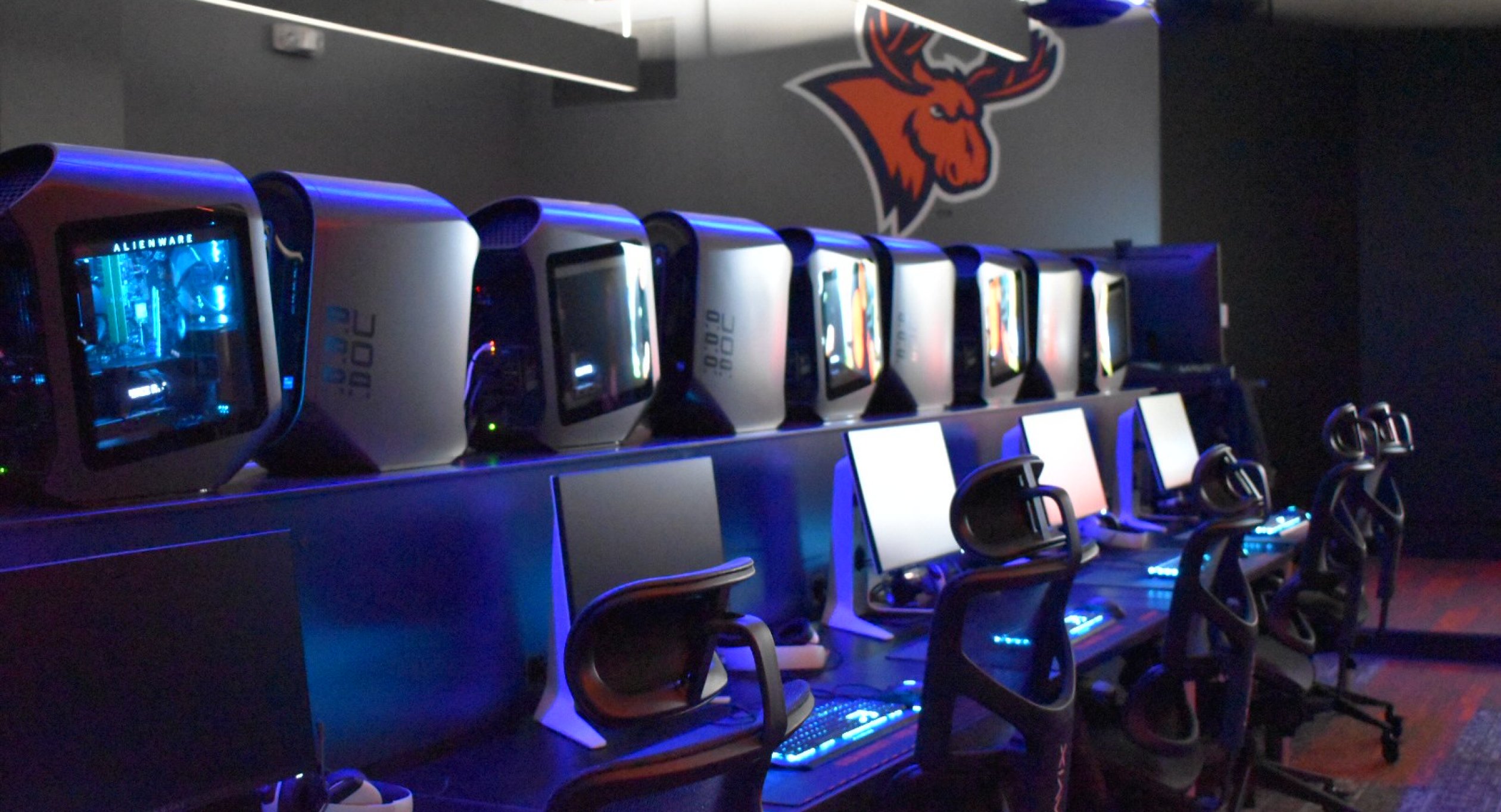 A row of seats and computers in the all-new eSports auditorium.