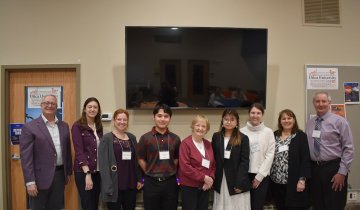 Wilcox Fellows stand with President Todd Pfannestiel and members of the Wilcox Family during the 2024 Wilcox Fellows Reception.