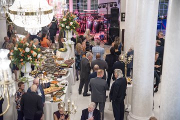 Attendees mingle at the Community Dinner.